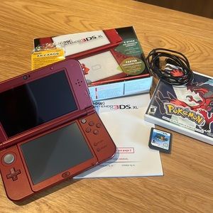 Nintendo 3DS XL with Pokémon Y, Super Mario DS